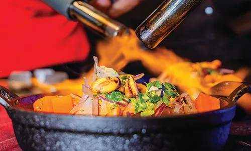 Flaming pan with fresh seafood at Chef Showdown