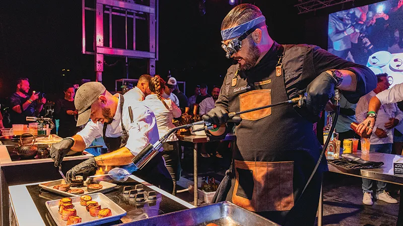Chef torching dishes on the Chef Showdown stage
