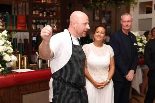 Chef addressing guests before a dinner service