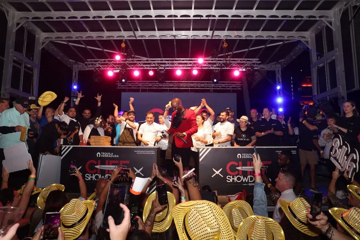 Festival crowd in gold cowboy hats