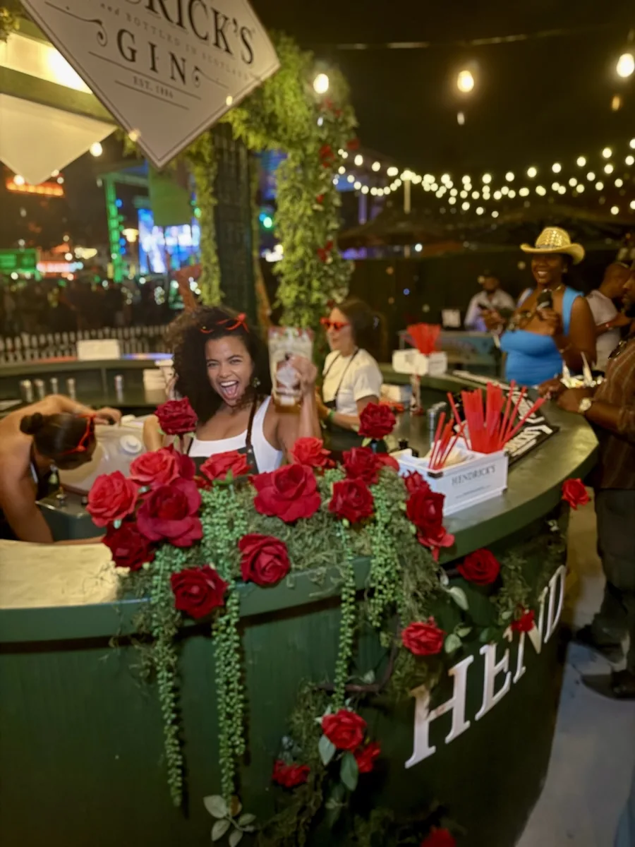 Guest at the Hendrick's rose-covered bar