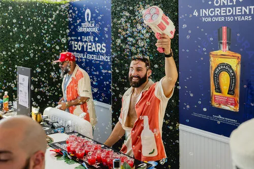 Bartenders serving cocktails in a cloud of bubbles at the Tequila Herradura bar