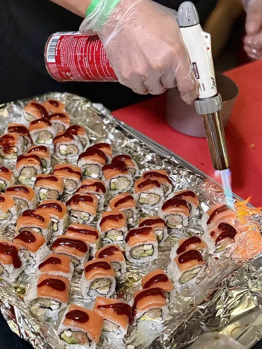 Chef torching sushi at the VIP Chef Showdown
